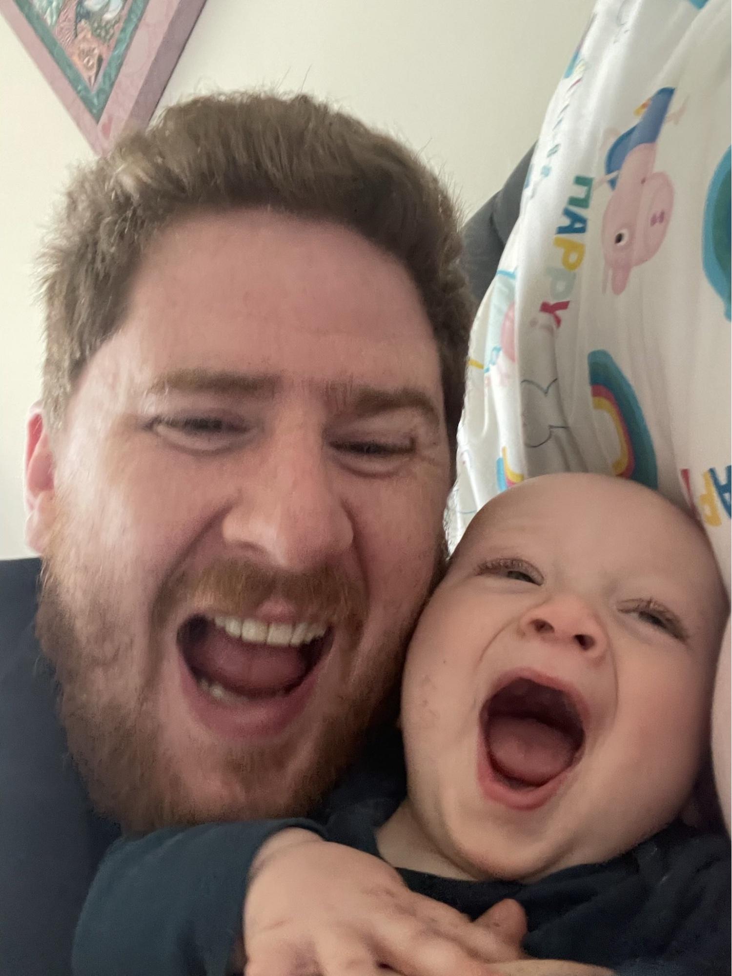 David Flanagan and his infant son having a laugh